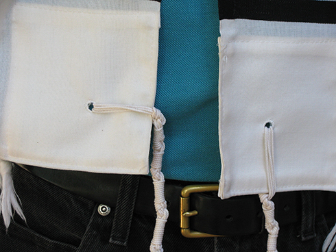 The tzitzit should hang down along the vertical border (screen left/model&#39;s right side)